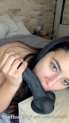 bellabb thrusts a black dildo inside her cunt