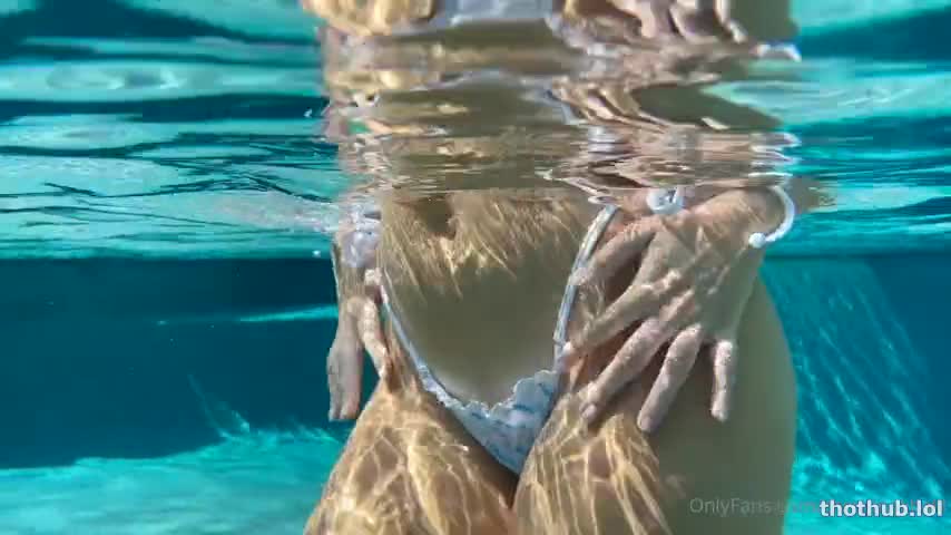 Christina Khalil relaxing pool swimsuit