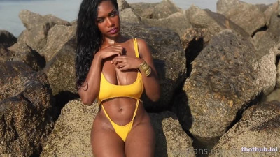 Dulcemoon OnlyFans leaked Dulcemoon in her yellow swimsuit on the rocks on HDthot